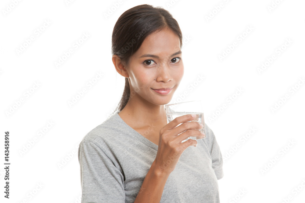 Young Asian woman with a glass of drinking water. Young Asian woman with a glass of drinking water.