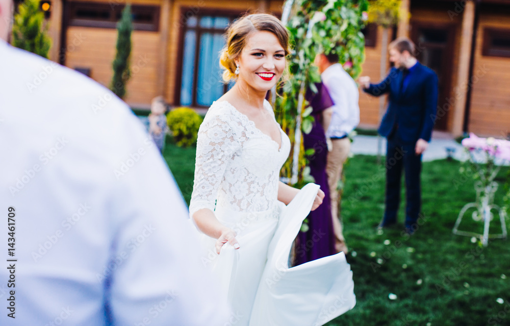 Naklejka premium The happinest bride goes to wedding ceremony