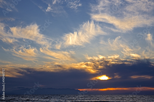 Cirrus clouds at sunset Aegean Sea Kuşadası Turkey photo