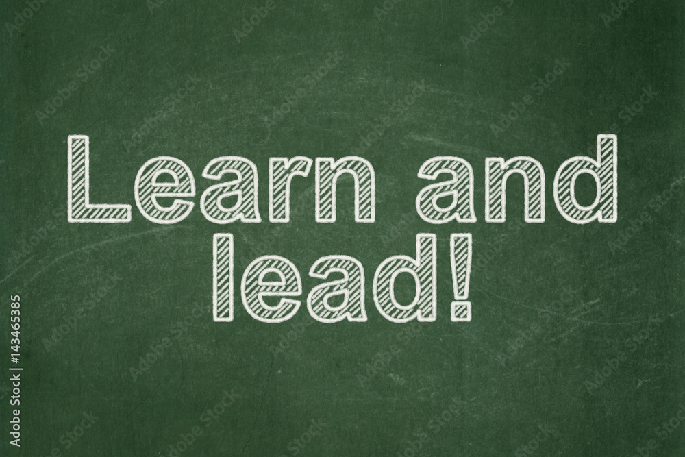 Fototapeta premium Education concept: Learn and Lead! on chalkboard background
