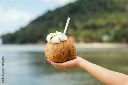 Conconut drink in hand photo