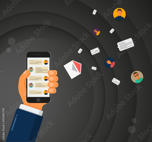 Concept of mobile chat. Hand is holding a smartphone with messenger app. Email, avatars, chat bubbles are flying out phone