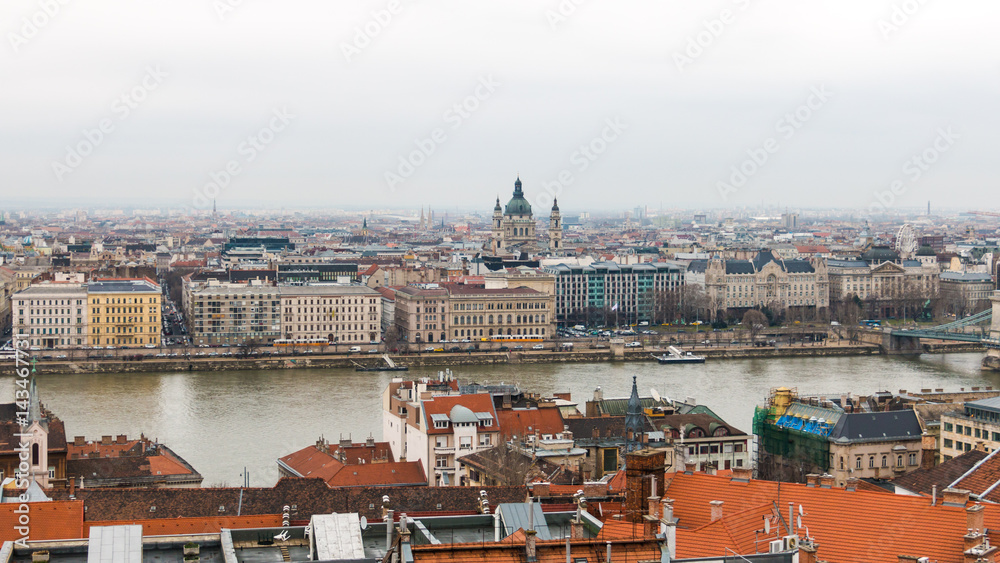 Scenic view of Pest side with St. Stephen's Basilica in center and Danube river in Budapest Hungary with haze on the horizon after the rain