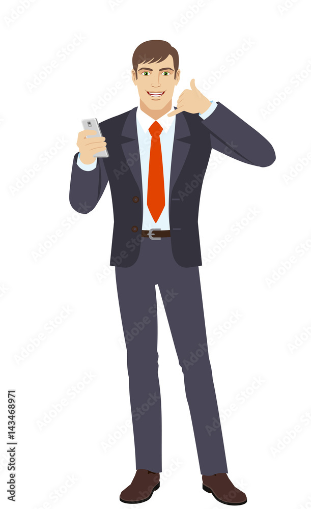 Businessman with mobile phone showing a call me sign Businessman with mobile phone showing a call me sign