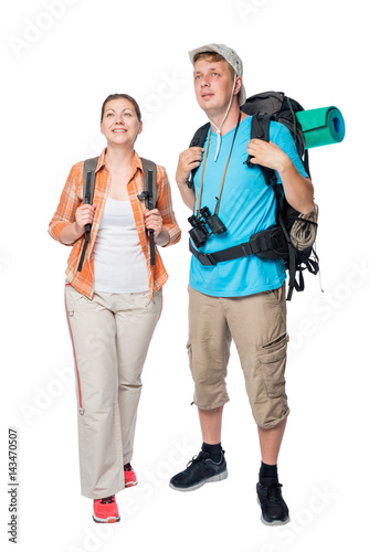 vertical portrait in full length of happy tourists with backpacks on a white background