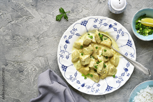 Canvas Print Chicken fricassee in a white sauce garnished with boiled rice