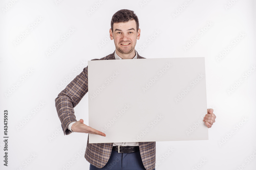 young man holding white blank panel with space for text on white background. young man holding white blank panel with space for text on white background.