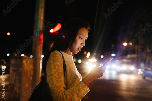 20 something uses cell phone GPS to find restaurant in Old Havana, Havana Cuba