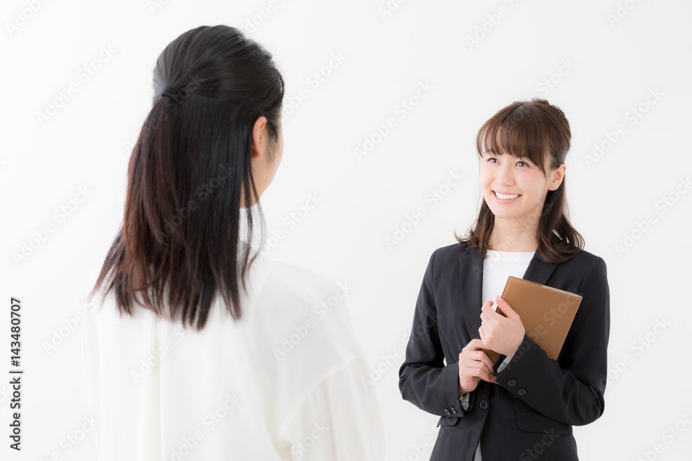 asian businesswomen talking on white background asian businesswomen talking on white background