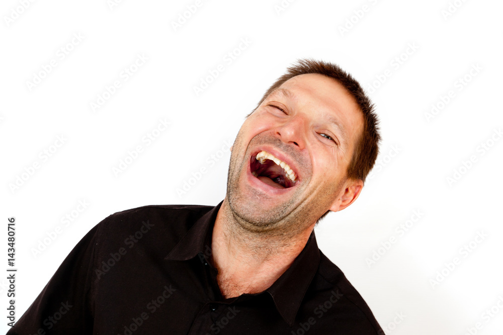 Young cheerful man laughing Young cheerful man laughing