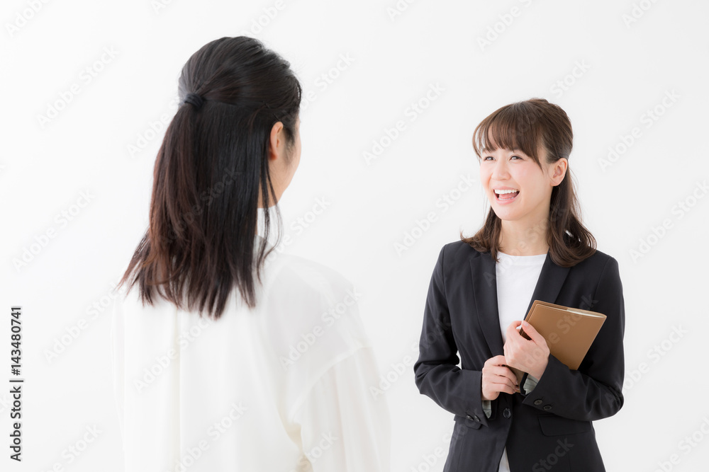 asian businesswomen talking on white background asian businesswomen talking on white background