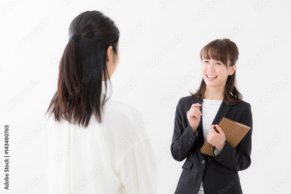 asian businesswomen talking on white background asian businesswomen talking on white background