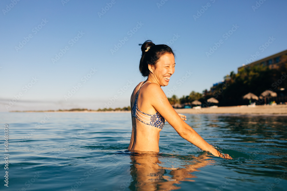 Happy young woman enjoying in sea Happy young woman enjoying in sea