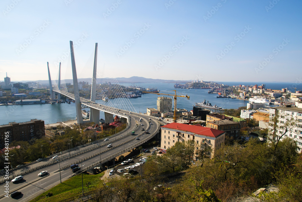 Golden bridge — cable-stayed bridge across the Zolotoy Rog Bay in Vladivostok. Was built in the framework of preparation to the APEC summit. Modern bridges Russia. The traffic of the port city. 