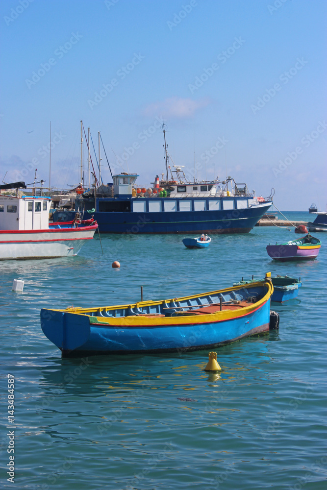 traditional fishing boats in the harbor of Marsaxlokk, Malta traditional fishing boats in the harbor of Marsaxlokk, Malta