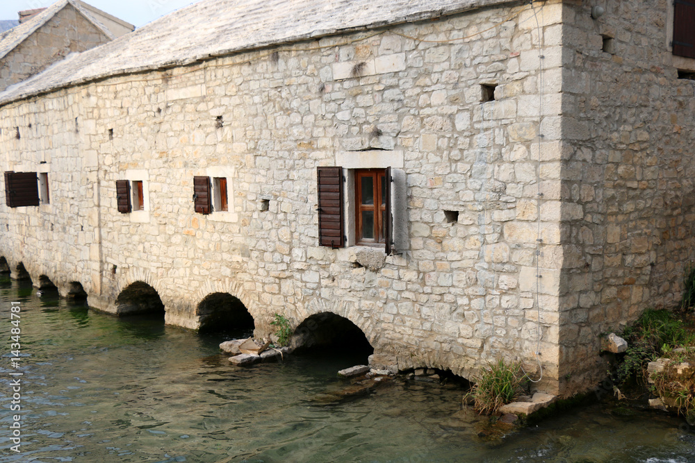 Traditional 17th-century watermill called 'Gaspina mlinica' on river Jadro in Solin, Croatia. Architectural detail.
