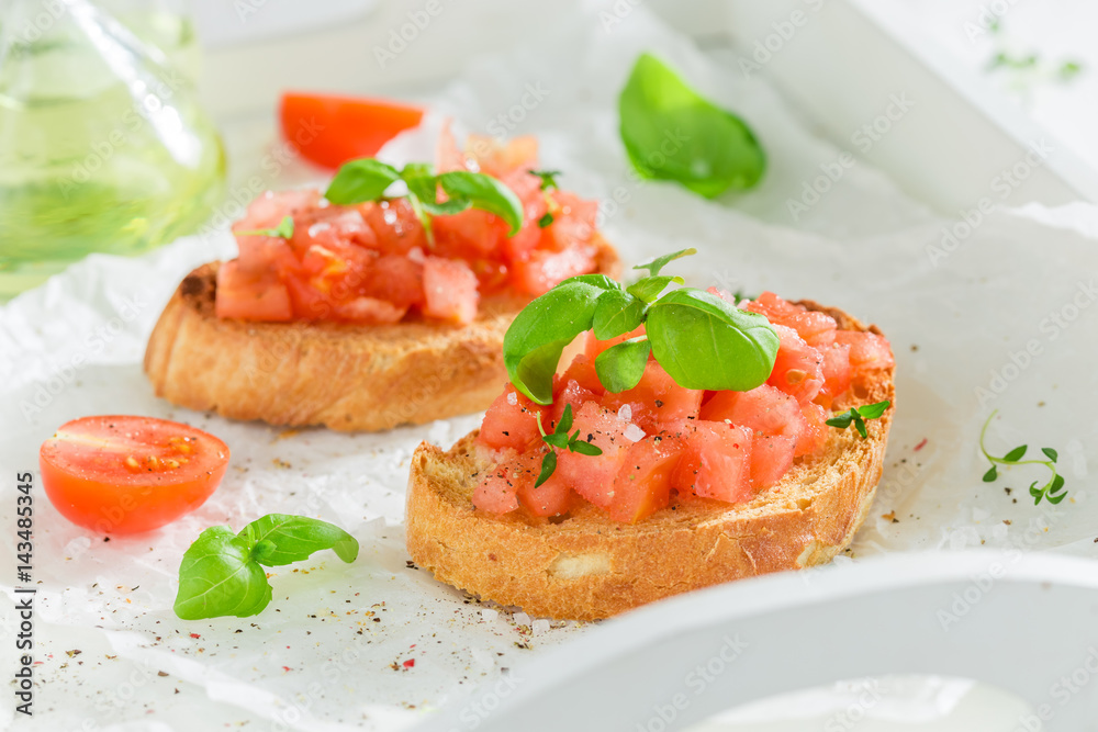 Fresh bruschetta with basil and tomato for a snack Fresh bruschetta with basil and tomato for a snack