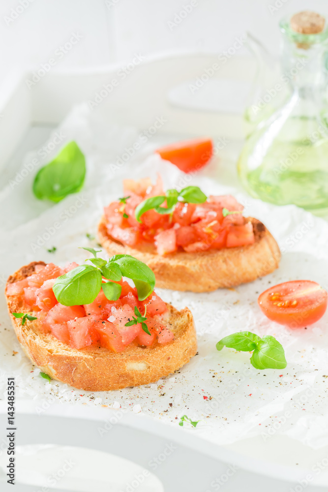 Tasty bruschetta with tomato and basil for a snack