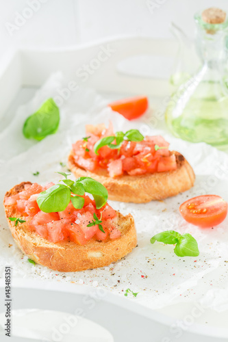 Tasty bruschetta with tomato and basil for a snack