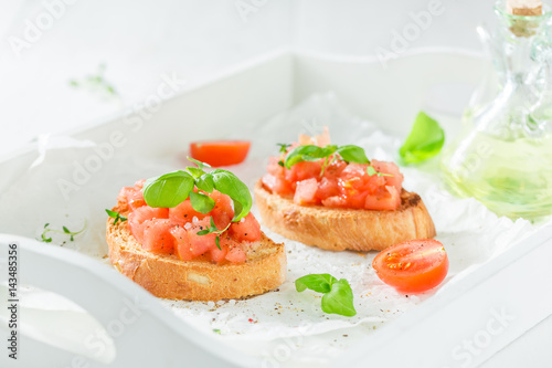 Crisp bruschetta with basil and tomato for breakfast
