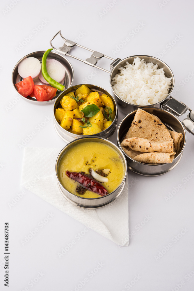 indian typical stainless steel lunch box or tiffin with north indian or