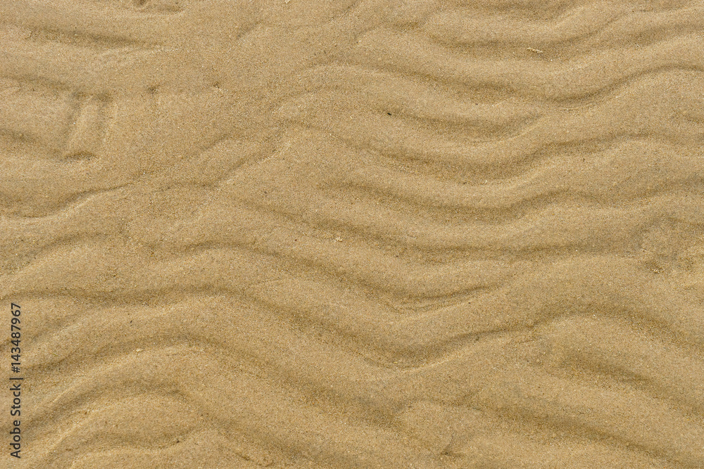 Fototapeta premium closeup of wet sand pattern of a beach in the spring