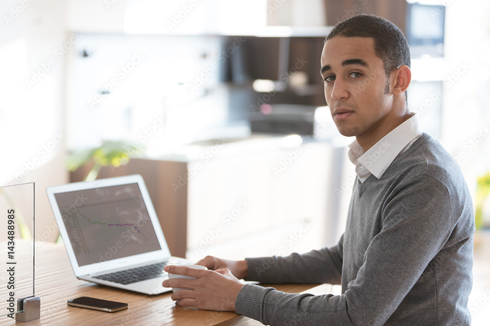 Man at desk with laptop in office Man at desk with laptop in office