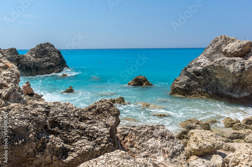 Seascape with rocks in blue waters of Megali Petra Beach, Lefkada, Ionian Islands, Greece