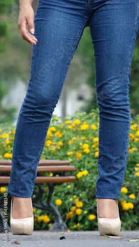 Female Legs Blue Jeans And High Heels
