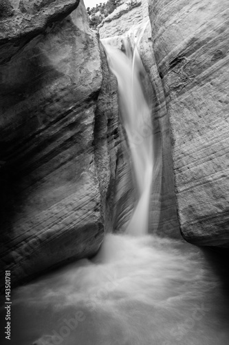 slot canyon waterfall in black and white