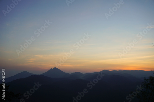 Bight and colorful high mountain landscape in haze. © atid28