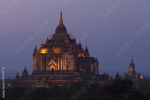 Huge temple lit up in Bagan after sunset 
