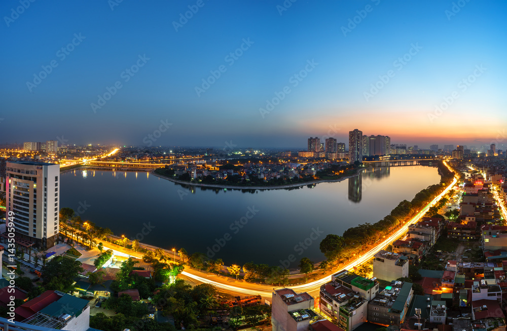 Aerial view of Hanoi skyline cityscape at twilight period. Linh Dam lake, south of Hanoi capital