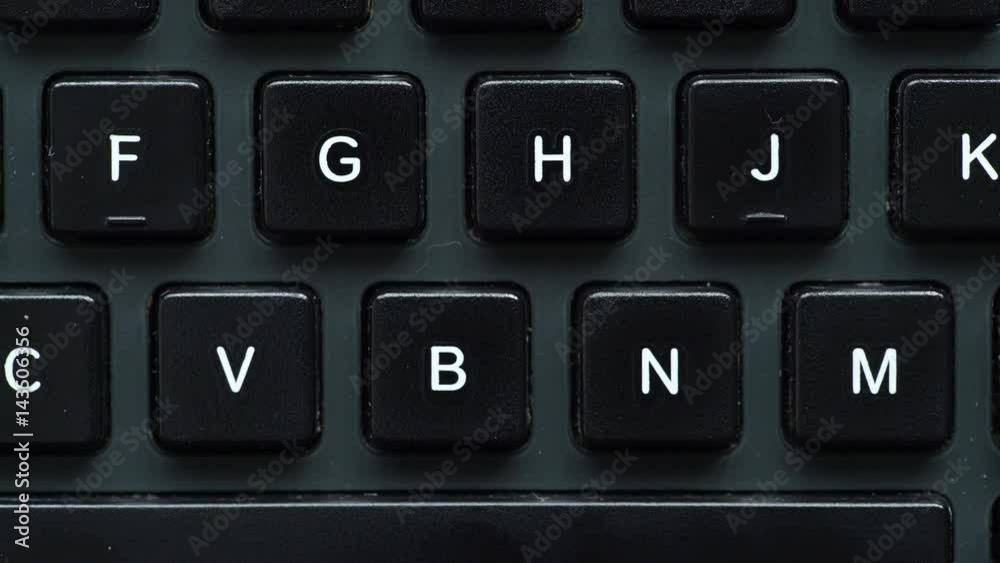 Black computer keyboard detail view closeup. Motorized slider 4K ProRes HQ codec Black computer keyboard detail view closeup. Motorized slider 4K ProRes HQ codec