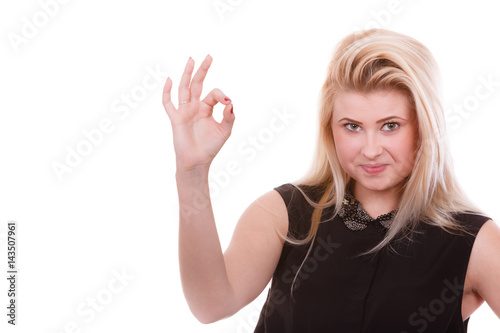 Blonde woman showing a ok gesture © anetlanda