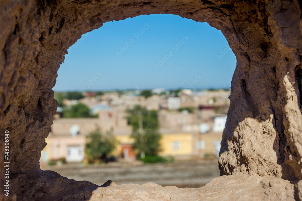 View over Khiva through the city wall's hole