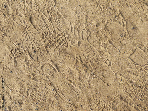 marks from shoes on the sand