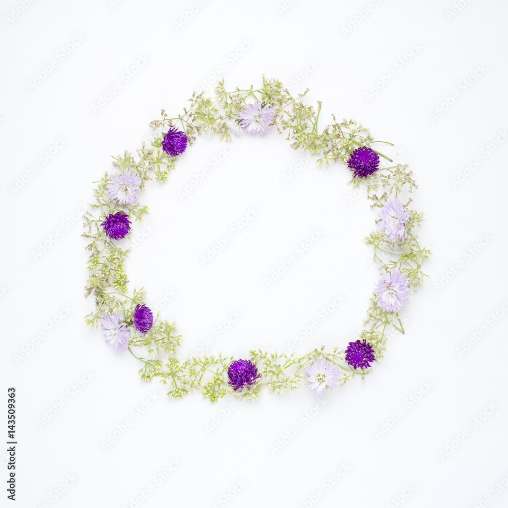 round frame wreath pattern with Globe Amaranth, blue cutter and wild ﬂowers on white background. flat lay, top view