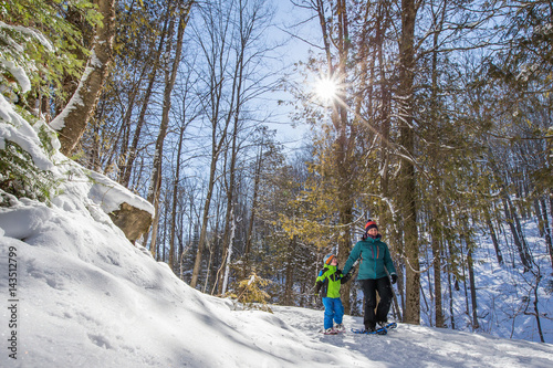 Obraz na płótnie Mother and sun snowshoeing in Ontario, Canada w salonie