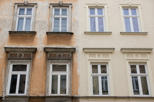 The facades of two houses standing side by side.