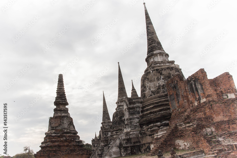 Fototapeta premium Ancient break pillar pagoda and sky at wat phra sri sanphet temple Ayutthaya Thailand