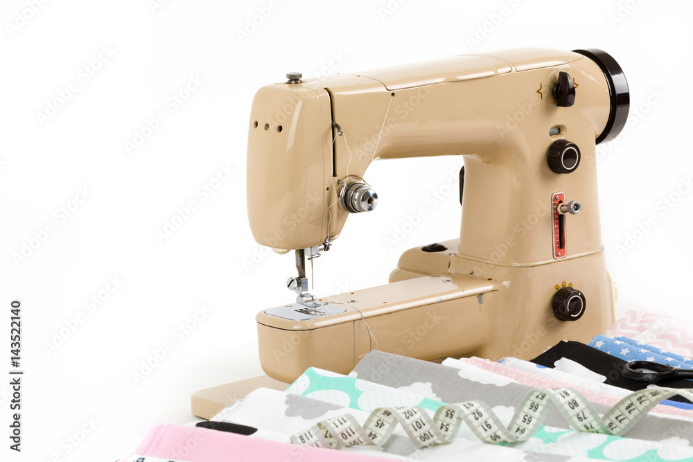 Sewing machine, fabric and measurement tape