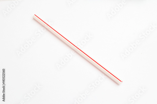 red straw for drinking on white background