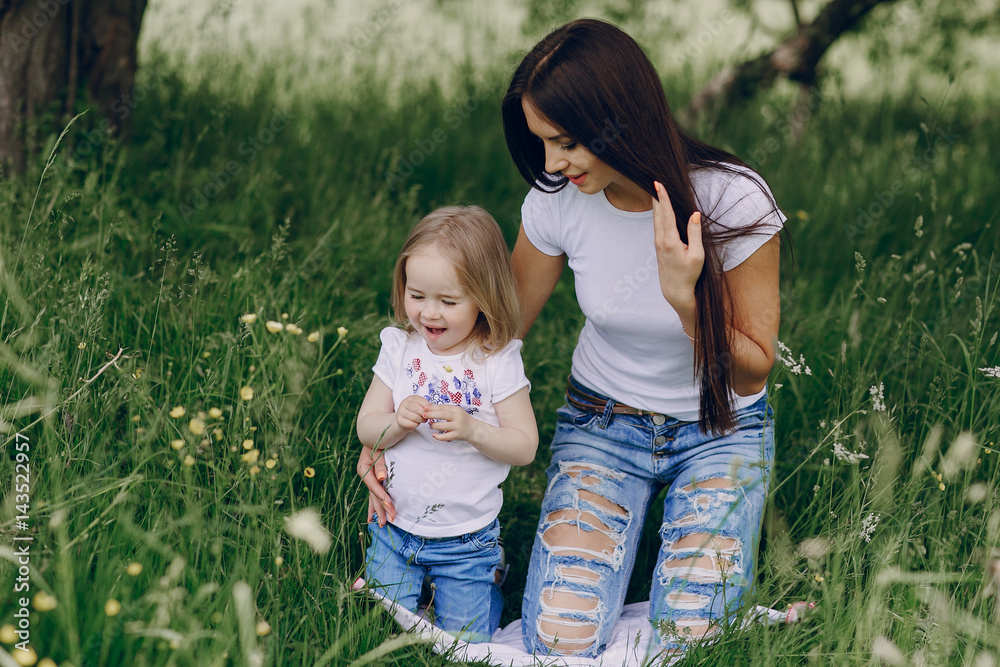 Fototapeta premium child near tree with mom