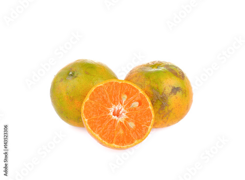 Organic orange fruit on white background