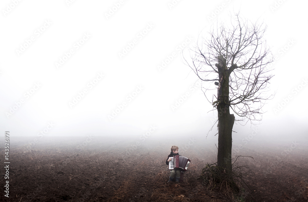 Fairytale photography. Boy playing in harmony