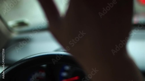 Men's hands nervously hit the steering wheel of the car in a traffic jam. Close-up