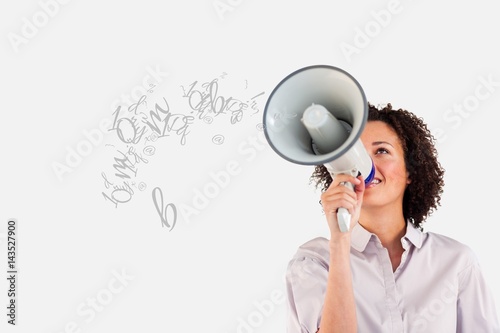 Young businesswoman talking in megaphone