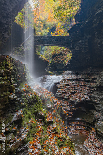 Beautiful waterfall cascade at Watkins Glenn state park, with autumn foliage colors