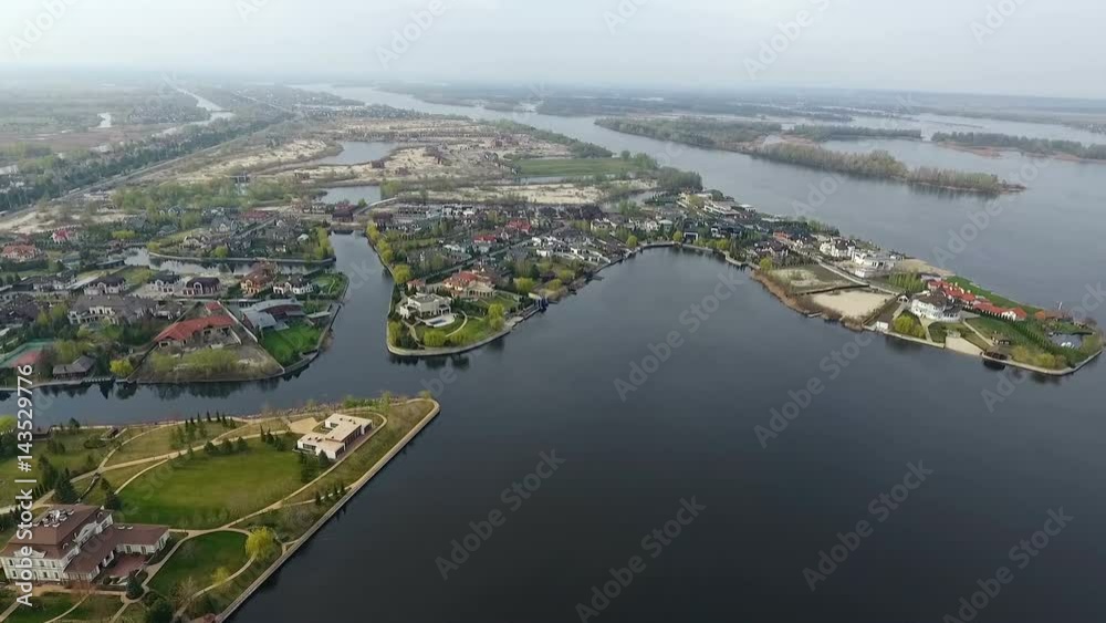 A small beautiful village near the river. Aerial view A small beautiful village near the river. Aerial view